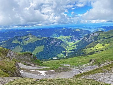 View of the Loch alpine valley over the Iberig region and below the foot of a mountain range First, Oberiberg - Canton of Schwyz, Switzerland (Kanton Schwyz, Schweiz)