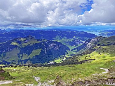 View of the Loch alpine valley over the Iberig region and below the foot of a mountain range First, Oberiberg - Canton of Schwyz, Switzerland (Kanton Schwyz, Schweiz)