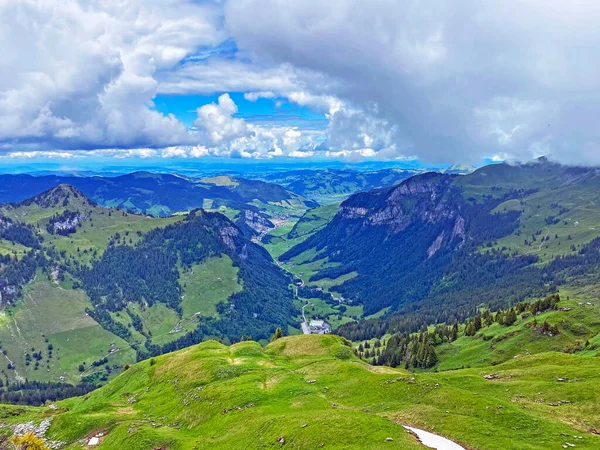 View of the Loch alpine valley over the Iberig region and below the foot of a mountain range First, Oberiberg - Canton of Schwyz, Switzerland (Kanton Schwyz, Schweiz)