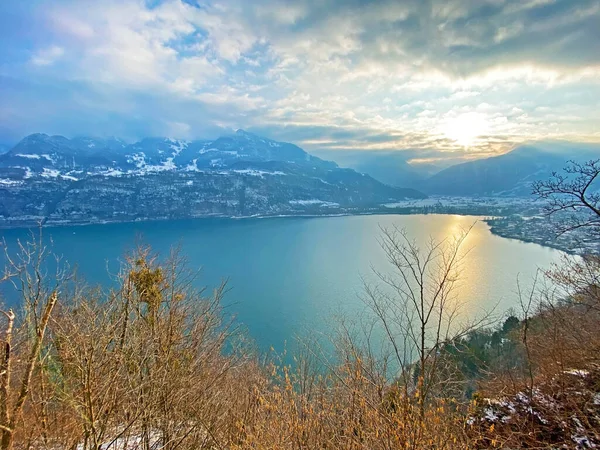 Lake Walen in winter or Lake Walenstadt (Walensee) between the mountain ranges of Churfirsten and Glarus Alps, Amden - Canton of St. Gallen, Switzerland (Kanton St. Gallen, Schweiz)