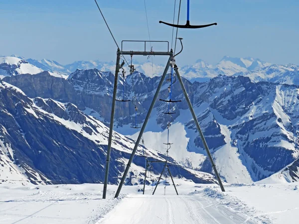 T-bar ski lift (Platter - Button lift) or Teleski a archets (a sellettes - Glacier 3000), Les Diablerets - Canton of Vaud, Switzerland (Suisse)