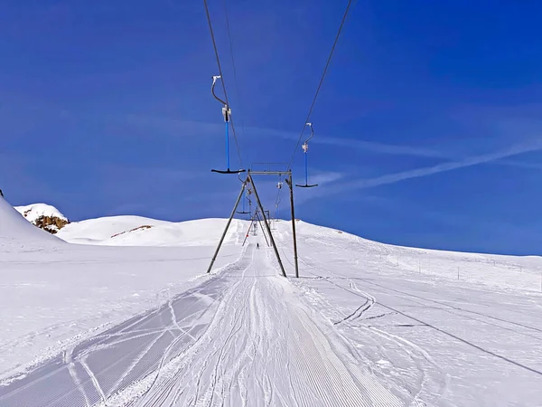 T-bar ski lift (Platter - Button lift) or Teleski a archets (a sellettes - Glacier 3000), Les Diablerets - Canton of Vaud, Switzerland (Suisse)