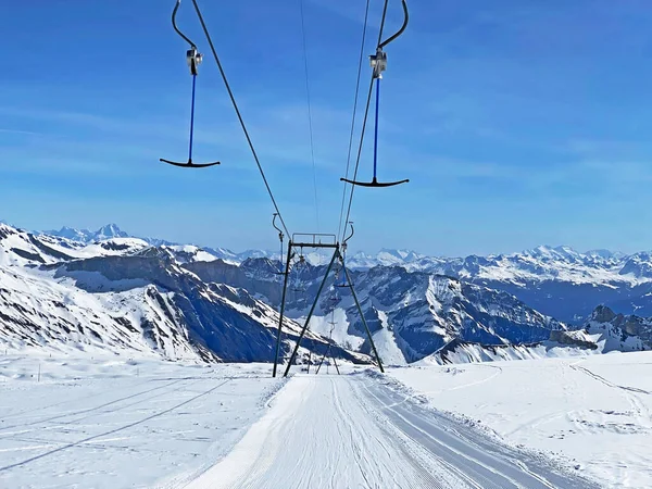 T-bar ski lift (Platter - Button lift) or Teleski a archets (a sellettes - Glacier 3000), Les Diablerets - Canton of Vaud, Switzerland (Suisse)