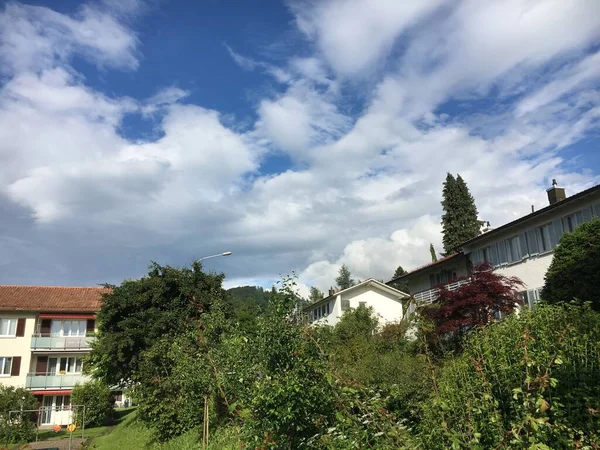 Pure white spring clouds in the clear sky above the Swiss city of St. Gallen, Switzerland (Schweiz)