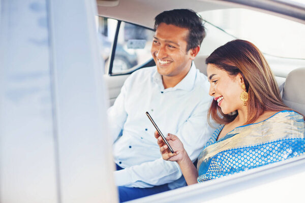 Indian Man Woman Using Mobile Phone App Book Taxi Sitting Royalty Free Stock Photos