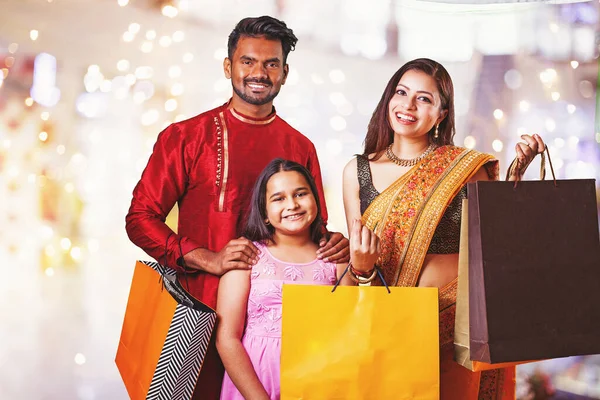 Beautiful Indian Family Wearing Traditional Clothing Holding Shopping Bags Gifts Royalty Free Stock Images