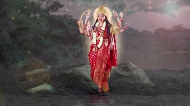 Hint tanrıçası Durga sekiz eliyle gölün kenarında kırmızı sari içinde duruyordu. Her yeri ışıldıyordu..