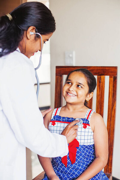 Cute Indian Little Girl Being Examined Paediatric Doctor Stock Image