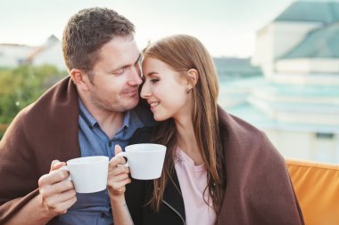 Couple  enjoying coffee together clipart