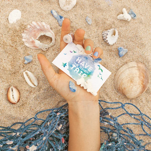 Hand holding a lovely card with "Have a nice trip" — Stock Photo, Image