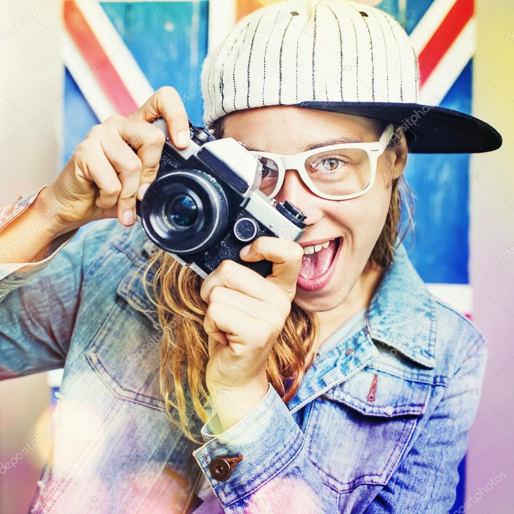 Young woman with retro camera