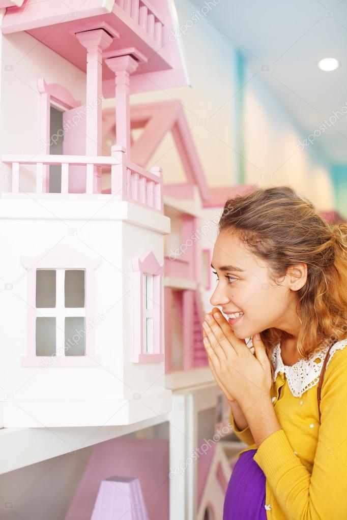 Woman buying a toy house