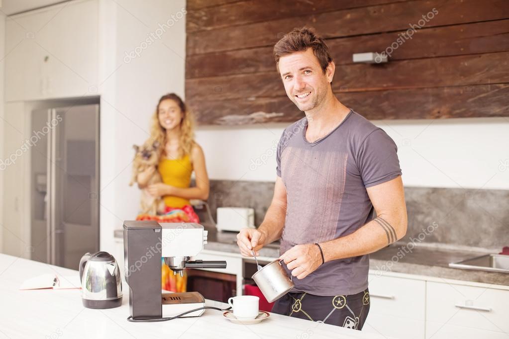 Man making coffee for his girlfriend