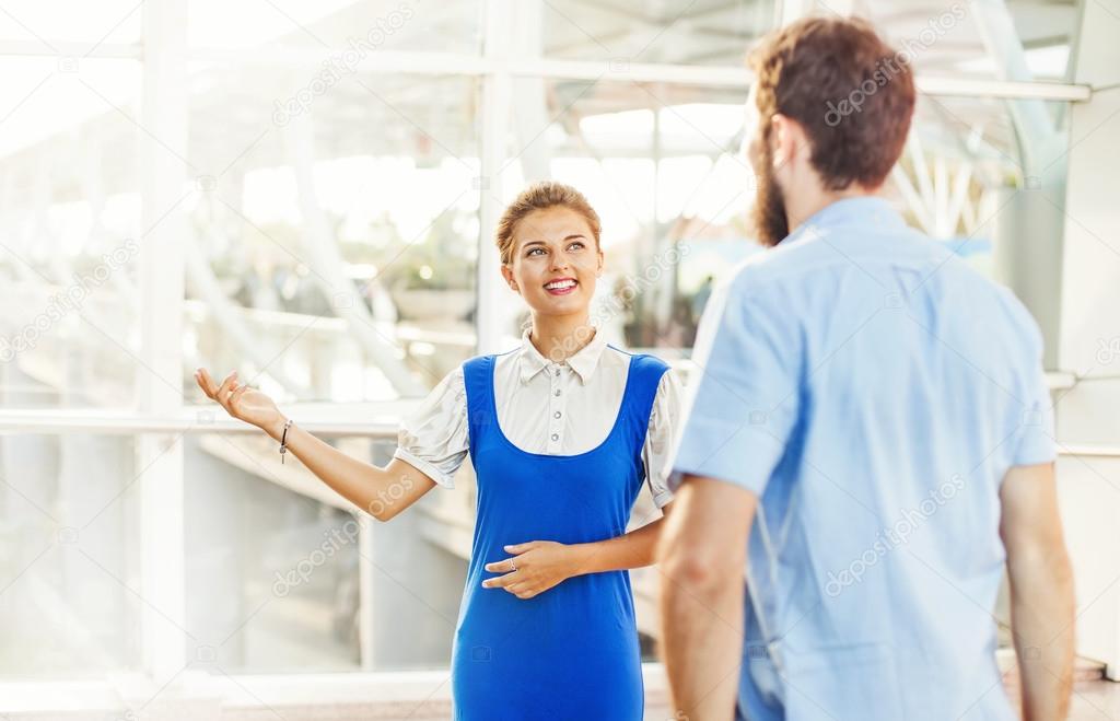 Flight attendant explaining the way for tourist