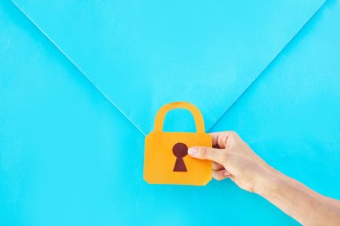 hand holding a lock over the envelope clipart