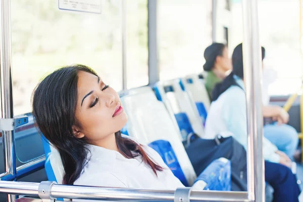 office worker sleeping in a bus