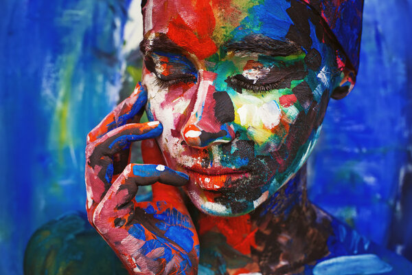 woman completely covered with thick paint