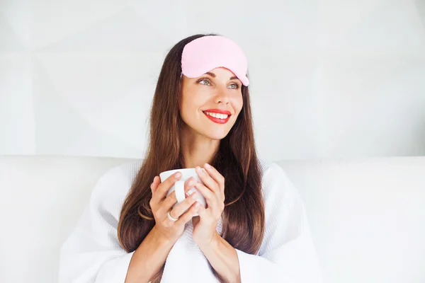 Woman drinking hot beverage — Stock Photo, Image