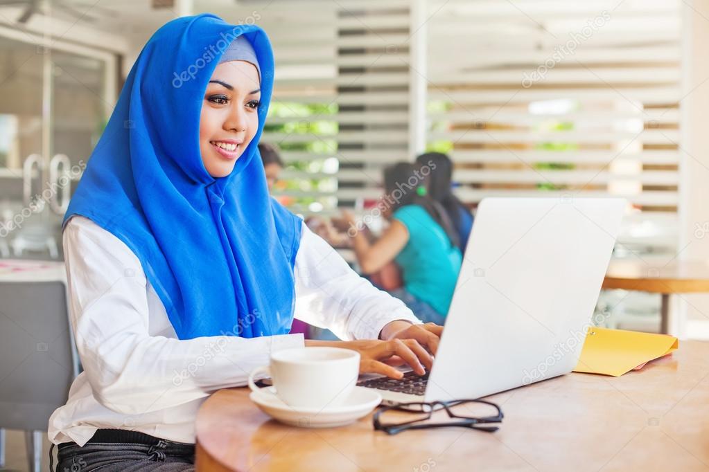 woman working in office with laptop
