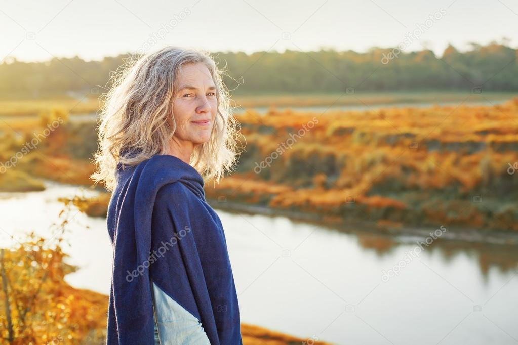 woman standing in front of the river