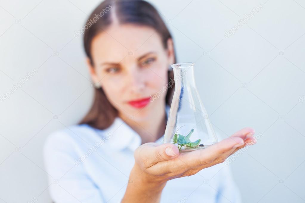 woman watching pest in a bulb