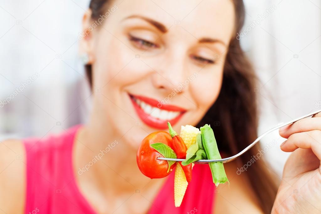 woman eating nasi kuning