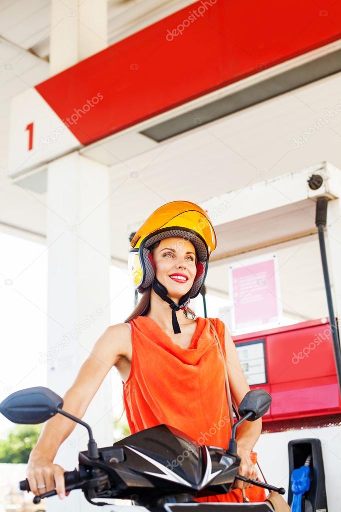 woman on a gas station