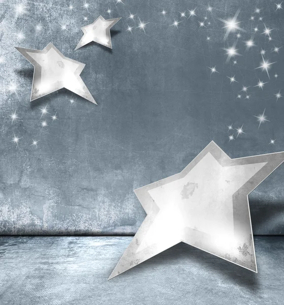 Estrellas de plata contra fondo gris azul - diseño abstracto de Navidad con luces brillantes — Foto de Stock