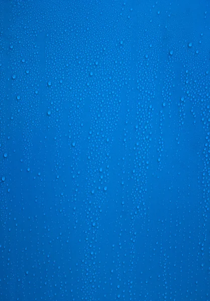 Superfície azul com gotas de água — Fotografia de Stock