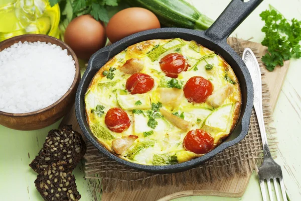 Zucchini baked with chicken, cherry tomatoes and herbs