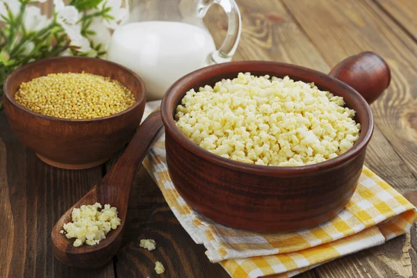 Millet porridge  in a ceramic pot — Stock Photo, Image