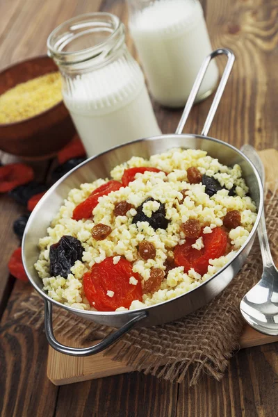 Millet porridge with dried fruit — Stock Photo, Image