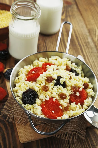 Millet porridge with dried fruit — Stock Photo, Image