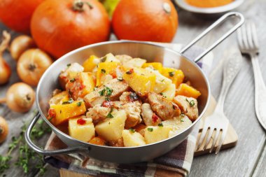Chicken stew with pumpkin, potatoes and spices clipart