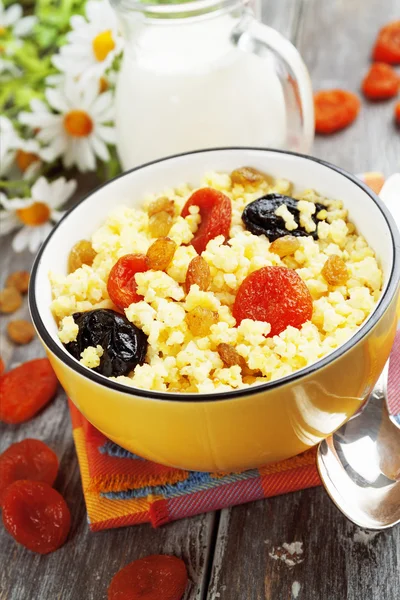 Millet porridge with dried fruit — Stock Photo, Image