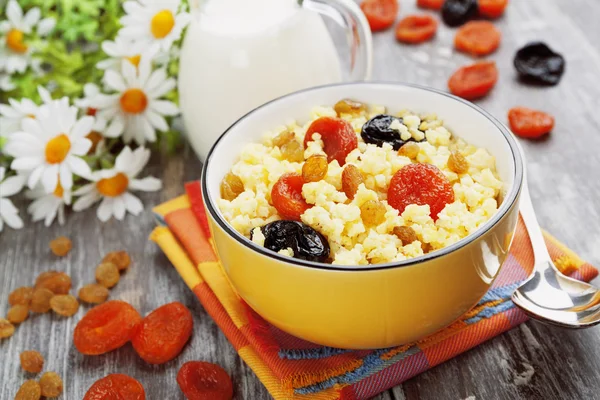 Millet porridge with dried fruit — Stock Photo, Image