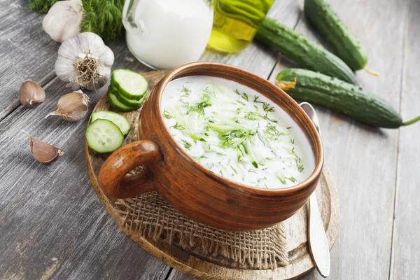 Summer soup with cucumbers, yogurt and fresh herbs Royalty Free Stock Images