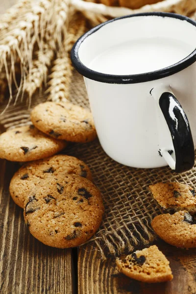 Cookies and mug with milk — Stock Photo, Image