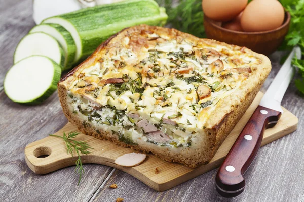 Pie with zucchini, sausage and herbs — Stock Photo, Image