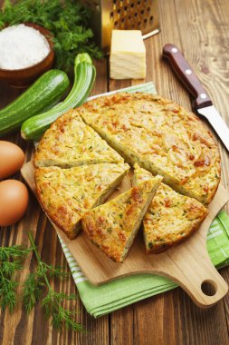 Zucchini pie with cheese and herbs clipart