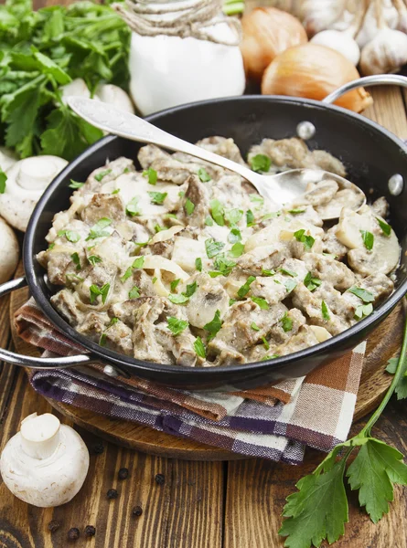 Liver with mushrooms in sour cream — Stock Photo, Image