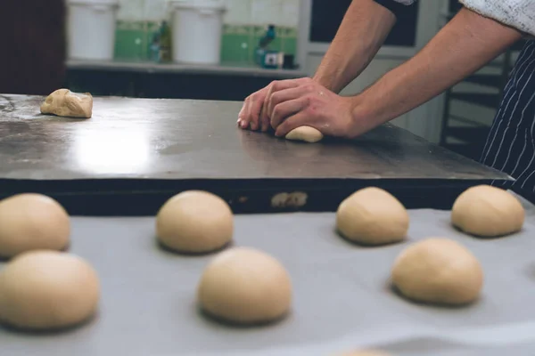 Man Kneading Dough Hamburger Buns Bakery Production Copy Space Selective — Stock Photo, Image