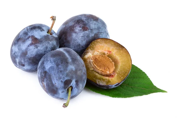 Organic plums fruit with leaves on white background. Closeup. — Stock Photo, Image