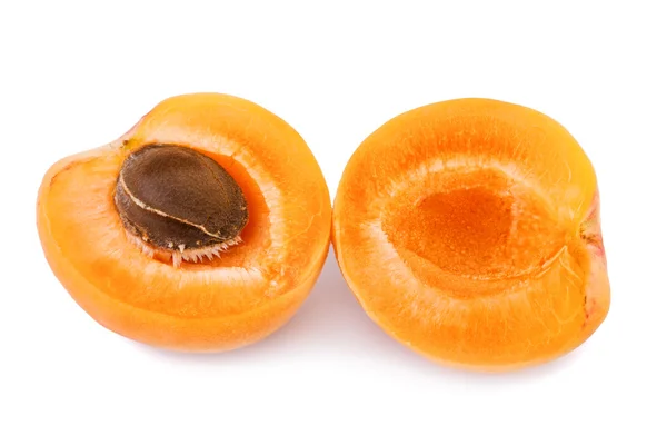 Apricot with fruit kernel on white background. Closeup. — Stock Photo, Image