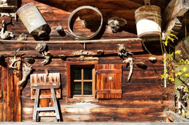 Rural alpine scenery. Retro decoration and architecture details of a alpine hut clipart