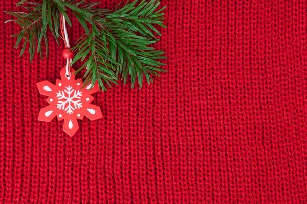 Christmas winter background of red wool knitted fabric with decoration — Stock Photo, Image
