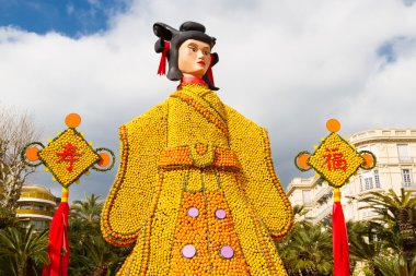 Lemon Festival (Fete du Citron) on the French Riviera.Theme for 2015 Tribulations of a lemon in China. Over 140 tonnes of lemons and oranges are used to build huge citrus constructions. Menton, France clipart