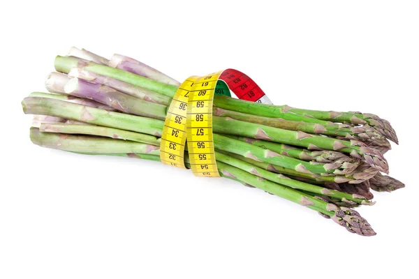 Спаржа овощ с измерительной лентой — стоковое фото