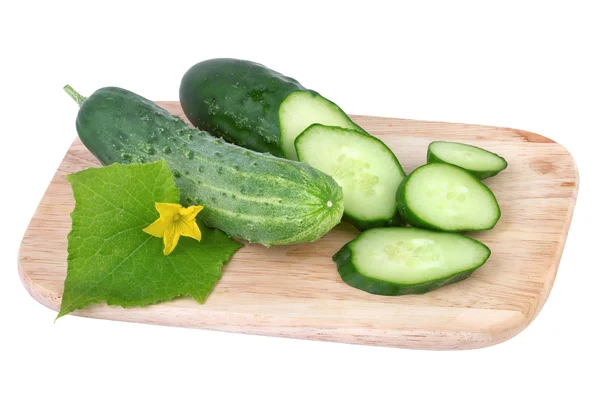 Cucumber on cutting board isolated on white — Stock Photo, Image