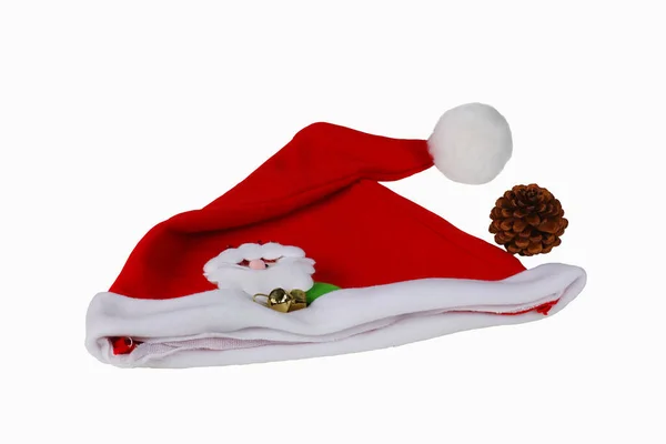 Bright red Santa Claus hat and pine cones